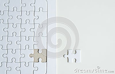 Jigsaw puzzle white colour,Puzzle pieces grid,Success mosaic solution template,Horizontal on white background copy space for text Stock Photo