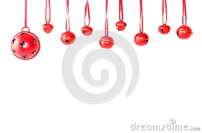 Jingle Bells with Ribbon Hanging in front of White Background Stock Photo