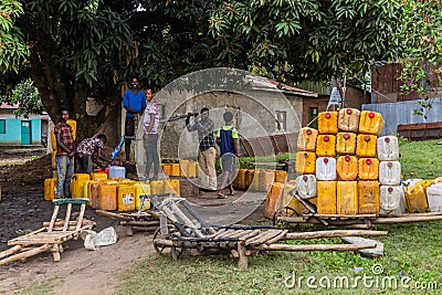 JINKA, ETHIOPIA - FEBRUARY 2, 2020: Local people at a well in Jinka, Ethiop Editorial Stock Photo