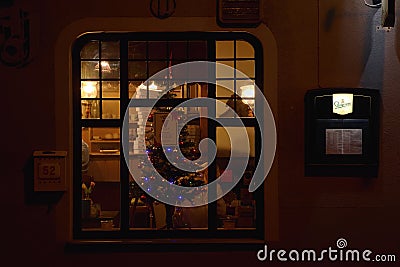 Jirkov, Czech republic - December 08, 2018: pizzerias window in historical centre of Jirkov city in christmas time Editorial Stock Photo