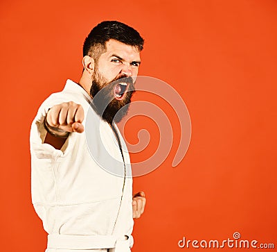 Jiu Jitsu master practices attack or defense posture Stock Photo