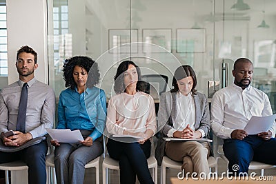 Job applicants waiting for their interviews in an office Stock Photo