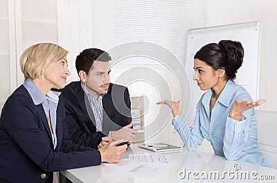 Job interview or business meeting: man and woman sitting at the Stock Photo