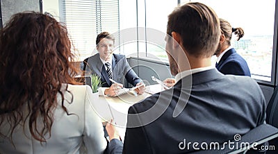 Job interview with the employer, businessman listen to candidate answers. Stock Photo