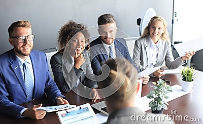 Job interview with the employer, businessman listen to candidate answers. Stock Photo