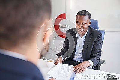 Two businessmen talking in office during recruitment process Stock Photo