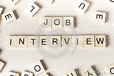 Job Interview word written on wood block. Wooden Abc Stock Photo