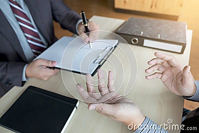 Job interview, Young attractive executives man asking questions Stock Photo