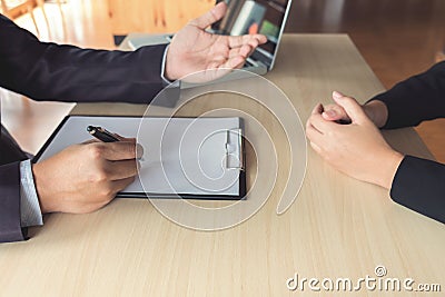 Job interview, Young attractive executives man asking questions Stock Photo