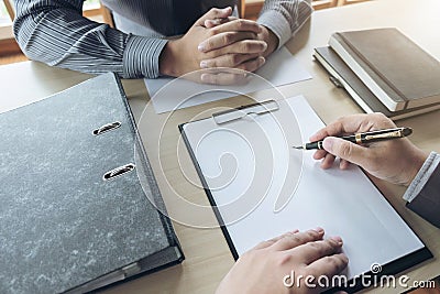 Job interview, Young attractive executives man asking questions Stock Photo