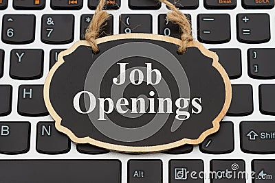 Job Openings message on chalkboard on a keyboard Stock Photo