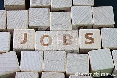 Job recruitment, career vacancy or hiring position in the company concept, cube wooden block with alphabet combine the word Jobs Stock Photo