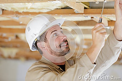 Job repairs man hands electric tool drill twist Stock Photo