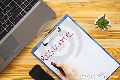 Job search. Female hand writes resume with lipstick on white she Stock Photo