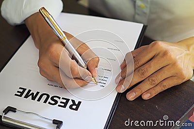 Job seekers are filling out their resume. Job Application Form Stock Photo