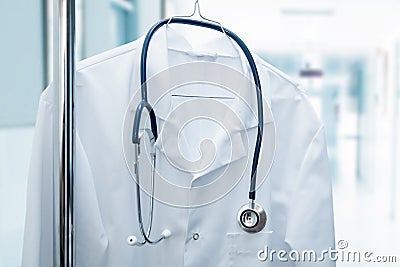 job vacancy - doctor coat on hanger in hospital hallway Stock Photo