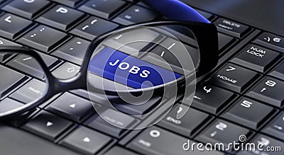 Jobs button through reading glasses. Stock Photo