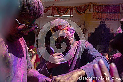 Jodhpur, rajastha, india - March 20, 2020: Group of Young indian men dancing celebrating holi festival, closeup of face covered Editorial Stock Photo