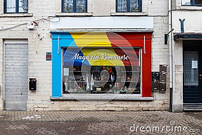 Jodoigne, Wallonia - Belgium - Romanian convenience market sotre with the facade painted in the colors of the national flag Editorial Stock Photo