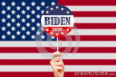 Joe Biden campaign button on the background of the USA flag. Election of the President of the United States of America Editorial Stock Photo