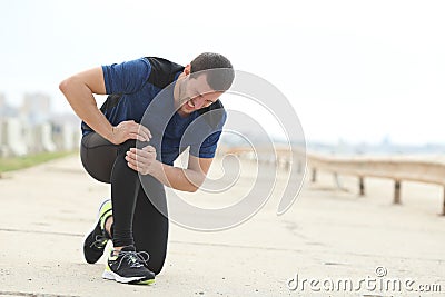 Jogger complaining suffering knee ache after sport Stock Photo