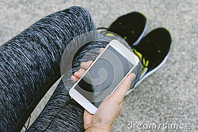 Jogger using smart phone, Female fitness exercise and cellphone. Stock Photo