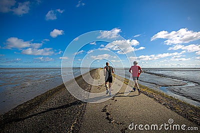 Joggers on the piers Editorial Stock Photo