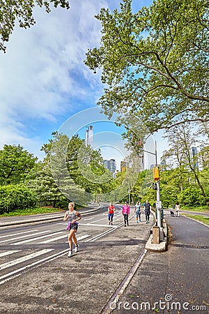 Joggers running through Central Park. Editorial Stock Photo