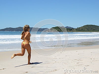 Jogging on the beach Stock Photo