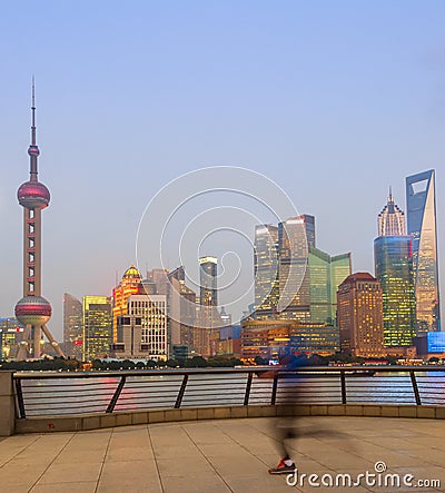 Jogging man, illuminated Shanghai cityscape Editorial Stock Photo
