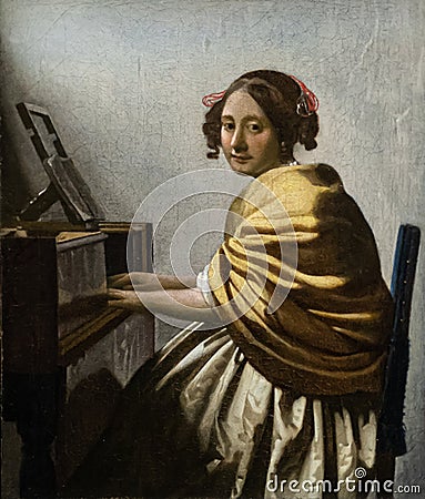 Young woman seated at a Virginal by Dutch golden age painter Johannes Vermeer Stock Photo