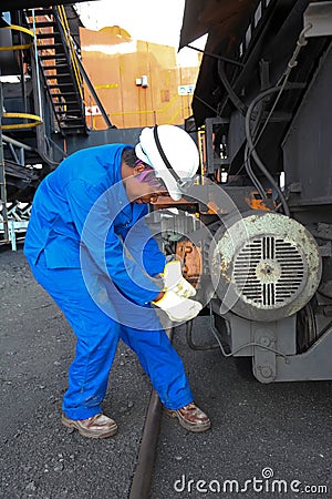 Female Technician checking equipment at Coal Burning Power Station Editorial Stock Photo