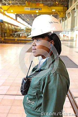 Female Technician in turbine room at Coal Burning Power Station Editorial Stock Photo