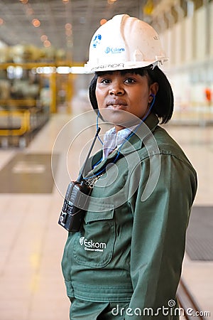 Female Technician in turbine room at Coal Burning Power Station Editorial Stock Photo