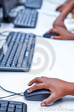 Childs hand on mouse button. Stock Photo