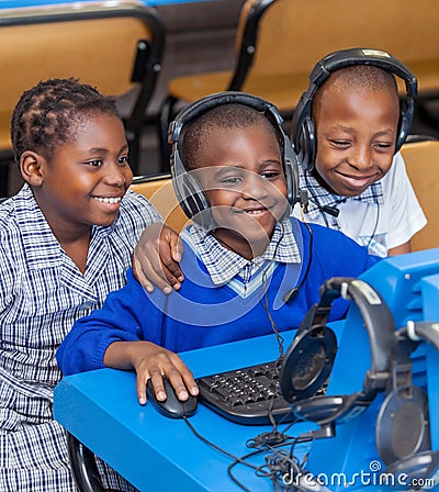 Kids looking at computer in school class room in Africa. Editorial Stock Photo