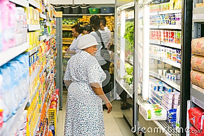 African customers shopping at local Pick n Pay supermarket grocery store Editorial Stock Photo