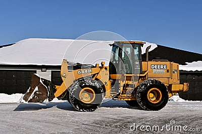 John Deere tractor and bucket for snow removal Editorial Stock Photo