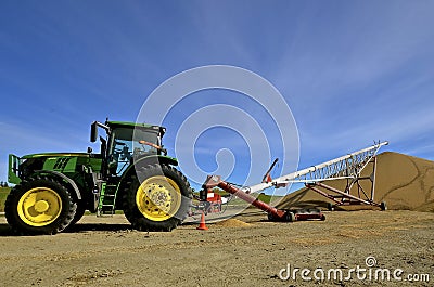 John Deere tractor Tube elevator transfers soybeans Editorial Stock Photo