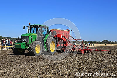 John Deere 7430 Tractor and Vaderstad Spirit 600C Seed Drill on Editorial Stock Photo