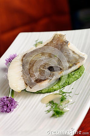 John Dory fish fillet on spinach Stock Photo