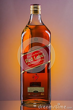 Johnnie Walker Red Label blended whisky on gradient background. Editorial Stock Photo
