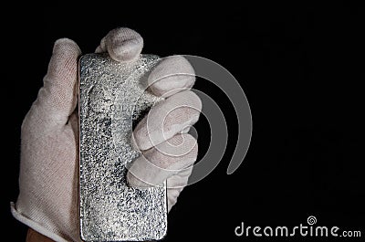 Johnson Matthey 1 Kilo Silver Bar Hand Held (reverse) Stock Photo