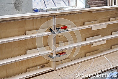Joinery. Plywood desk. Veneered plywood countertop manufacturing process. Furniture manufacturing Stock Photo