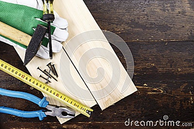 joinery tools on a dark brown wooden background, on a table in the workshop. Stock Photo