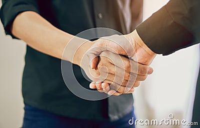 Joint Hands of Two Businessmen After Negotiating a Successful Business Agreement, And the handshake together. Stock Photo