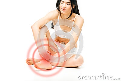 Joint pain, female person with leg stretching Stock Photo