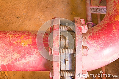 Joint pipe system Old big plumbing red which has dust dirty inside of building industrial Stock Photo