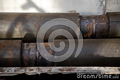 Jointed steel pipes insulated with polymer-mineral insulation in concrete slabs. Process of construction of heating Stock Photo