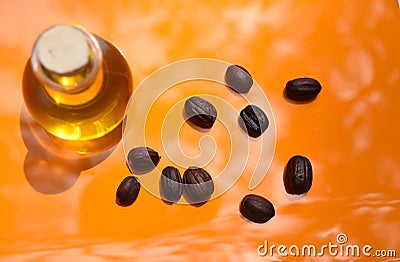 Jojoba oil on luxury orange background Stock Photo